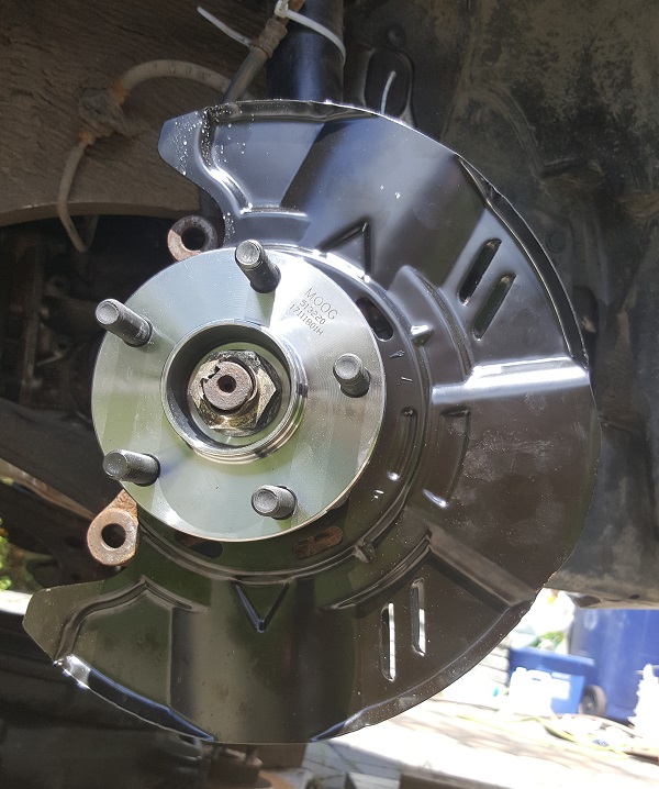Front wheel bearing and brake plate installed